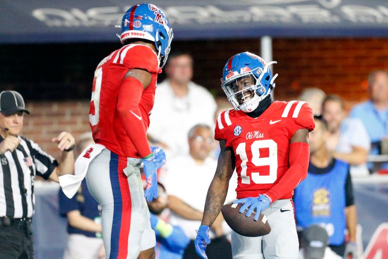 Oct 28, 2023; Oxford, Mississippi, USA; Mississippi Rebels wide receiver Tre Harris (9) and wide receiver Dayton Wade (19) react after a touchdown during the first half against the Vanderbilt Commodores at Vaught-Hemingway Stadium. Mandatory Credit: Petre Thomas-USA TODAY Sports