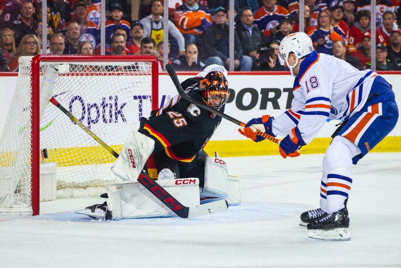 Apr 6, 2024; Calgary, Alberta, CAN; Calgary Flames goaltender Jacob Markstrom (25) makes a save against Edmonton Oilers left wing Zach Hyman (18) during the first period at Scotiabank Saddledome. Mandatory Credit: Sergei Belski-USA TODAY Sports