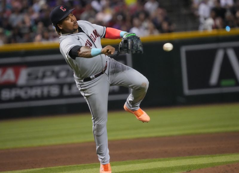 Jun 17, 2023; Phoenix, Arizona, USA; Cleveland Guardians infielder Jose Ramirez (11) throws to first base against the Arizona Diamondbacks at Chase Field. Mandatory Credit: Joe Rondone-USA TODAY Sports