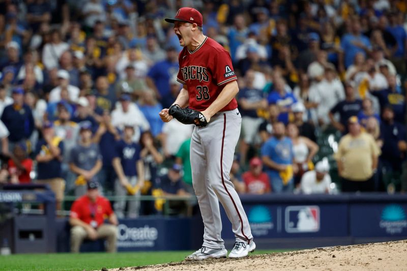 Oct 4, 2023; Milwaukee, Wisconsin, USA; Arizona Diamondbacks relief pitcher Paul Sewald (38) reacts after winning against the Milwaukee Brewers in the ninth inning during game two of the Wildcard series for the 2023 MLB playoffs at American Family Field. Mandatory Credit: Kamil Krzaczynski-USA TODAY Sports
