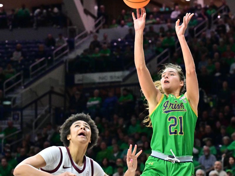 Feb 29, 2024; South Bend, Indiana, USA; Notre Dame Fighting Irish forward Maddy Westbeld (21) shoots over Virginia Tech Hokies forward Carys Baker (10) in the second half at the Purcell Pavilion. Mandatory Credit: Matt Cashore-USA TODAY Sports