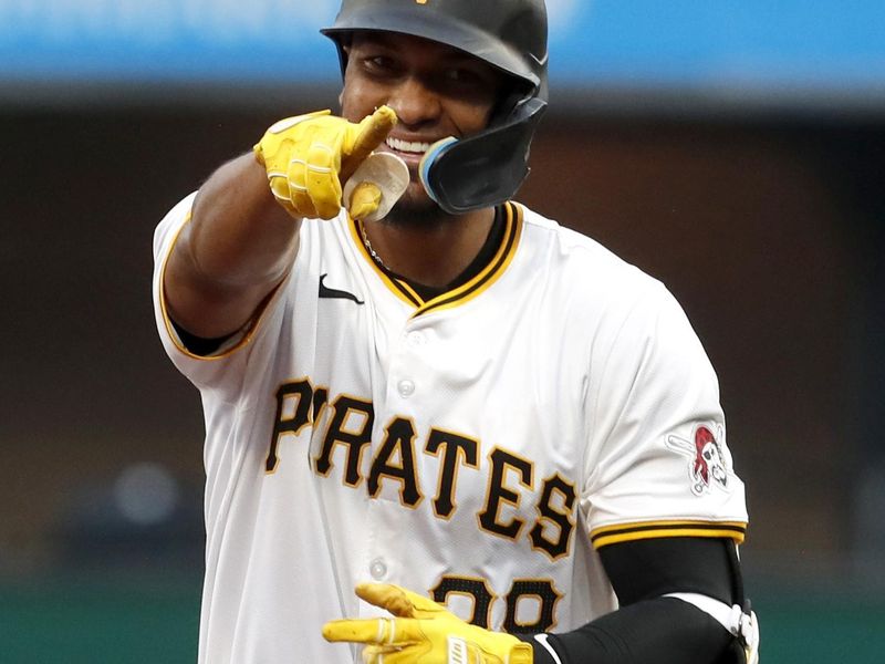 May 6, 2024; Pittsburgh, Pennsylvania, USA;  Pittsburgh Pirates right fielder Edward Olivares (38) gestures to the Pirates dugout as he circles the bases on a grand slam home run against the Los Angeles Angels during the third inning at PNC Park. Mandatory Credit: Charles LeClaire-USA TODAY Sports