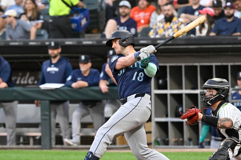 Jul 26, 2024; Chicago, Illinois, USA;  Seattle Mariners designated hitter Mitch Garver (18) hits an RBI double against the Chicago White Sox during the first inning at Guaranteed Rate Field. Mandatory Credit: Matt Marton-USA TODAY Sports