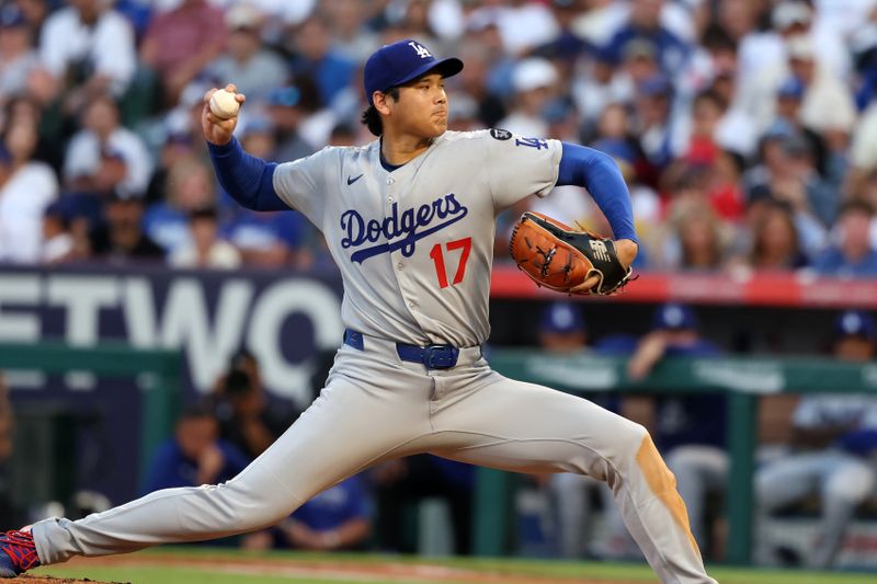 Aug 13, 2025; Anaheim, California, USA;  Los Angeles Dodgers two-way player Shohei Ohtani (17) pitches during the second inning against the Los Angeles Angels at Angel Stadium. Mandatory Credit: Kiyoshi Mio-Imagn Images