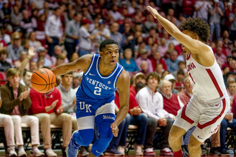 Jan 7, 2023; Tuscaloosa, Alabama, USA; Kentucky Wildcats guard Sahvir Wheeler (2) drives to the basket against Alabama Crimson Tide guard Mark Sears (1) during first half at Coleman Coliseum. Mandatory Credit: Marvin Gentry-USA TODAY Sports