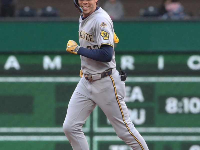 May 22, 2025; Pittsburgh, Pennsylvania, USA;  Milwaukee Brewers designated hitter Christian Yelich (22) reacts as he circles the bases on a three run home run against the Pittsburgh Pirates during the first inning at PNC Park. Mandatory Credit: Charles LeClaire-Imagn Images