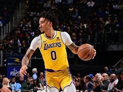DETROIT, MI - NOVEMBER 29: Jalen Hood-Schifino #0 of the Los Angeles Lakers  dribbles the ball during the game against the Detroit Pistons on November 29, 2023 at Little Caesars Arena in Detroit, Michigan. NOTE TO USER: User expressly acknowledges and agrees that, by downloading and/or using this photograph, User is consenting to the terms and conditions of the Getty Images License Agreement. Mandatory Copyright Notice: Copyright 2023 NBAE (Photo by Chris Schwegler/NBAE via Getty Images)