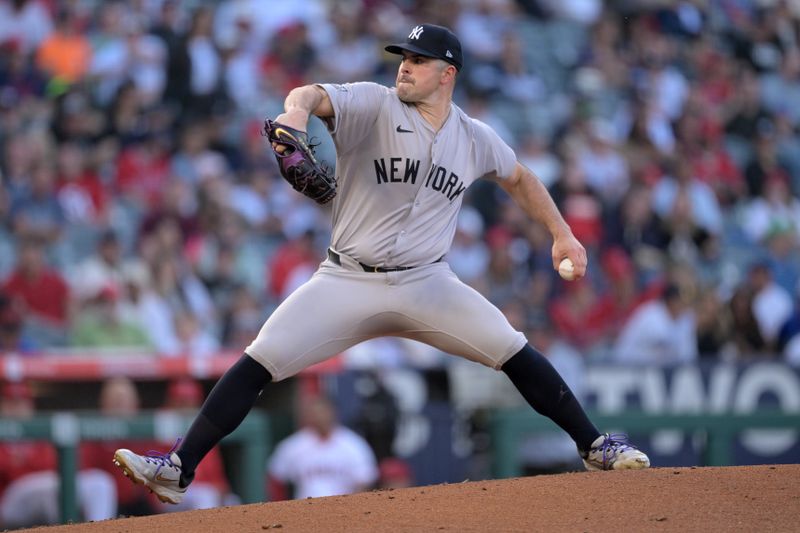 May 30, 2024; Anaheim, California, USA;  New York Yankees starting pitcher Carlos Rodon (55) delivers to the plate in the first inning against the Los Angeles Angels at Angel Stadium. Mandatory Credit: Jayne Kamin-Oncea-USA TODAY Sports