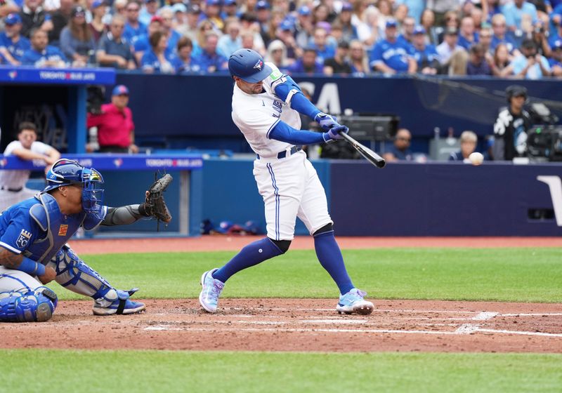 Sep 9, 2023; Toronto, Ontario, CAN; Toronto Blue Jays right fielder George Springer (4) hits a two run single against the Kansas City Royals during the fifth inning at Rogers Centre. Mandatory Credit: Nick Turchiaro-USA TODAY Sports