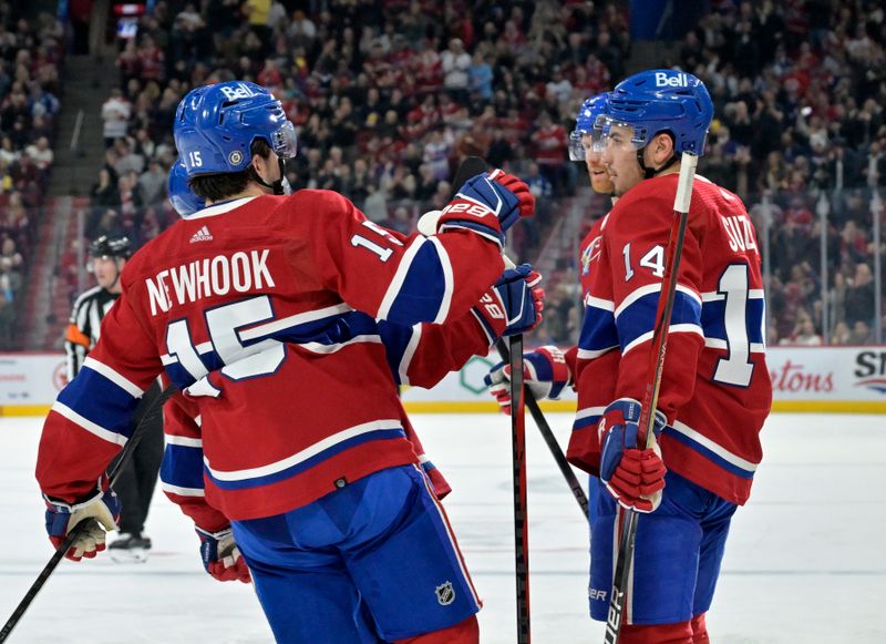 Apr 6, 2024; Montreal, Quebec, CAN; Montreal Canadiens forward Nick Suzuki (14) celebrates with teammate forward Alex Newhook (15) after scoring a goal against the Toronto Maple Leafs during the second period at the Bell Centre. Mandatory Credit: Eric Bolte-USA TODAY Sports