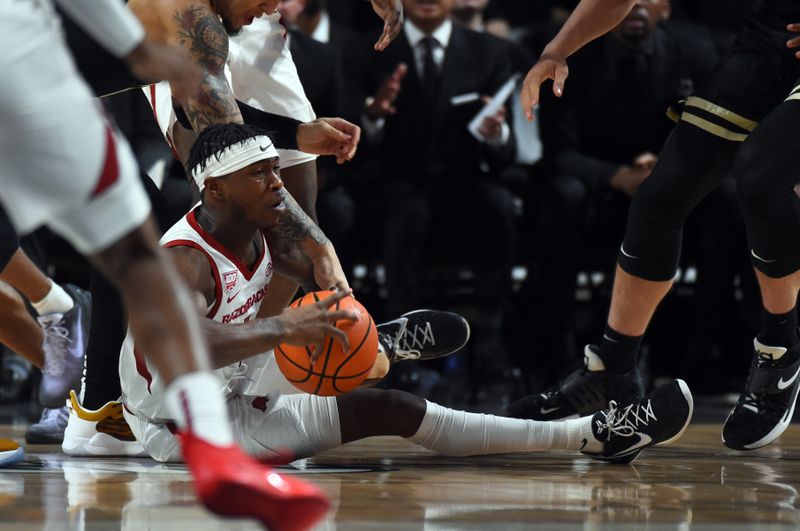 Jan 14, 2023; Nashville, Tennessee, USA; Arkansas Razorbacks guard Davonte Davis (4) battles for a loose ball during the first half against the Vanderbilt Commodores at Memorial Gymnasium. Mandatory Credit: Christopher Hanewinckel-USA TODAY Sports