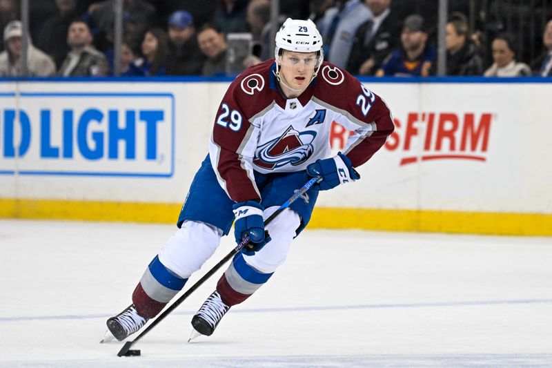 Feb 5, 2024; New York, New York, USA;  Colorado Avalanche center Nathan MacKinnon (29) skates with the puck against the New York Rangers during the second period at Madison Square Garden. Mandatory Credit: Dennis Schneidler-USA TODAY Sports