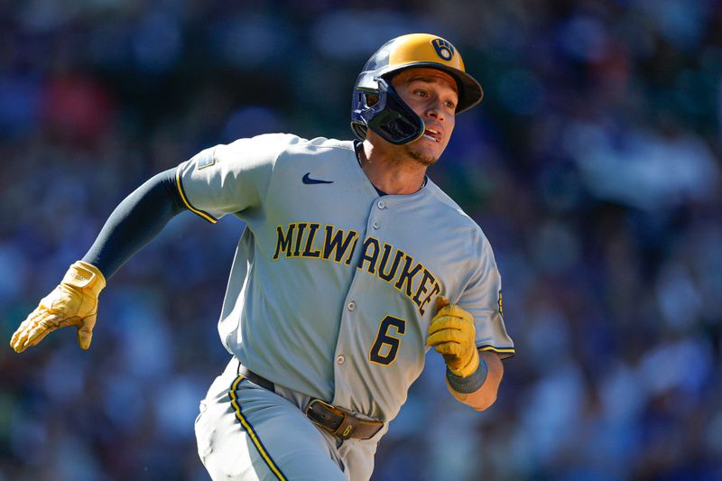 Aug 21, 2025; Chicago, Illinois, USA; Milwaukee Brewers left fielder Isaac Collins (6) runs after hitting a two-run single against the Chicago Cubs during the eight inning at Wrigley Field. Mandatory Credit: Kamil Krzaczynski-Imagn Images