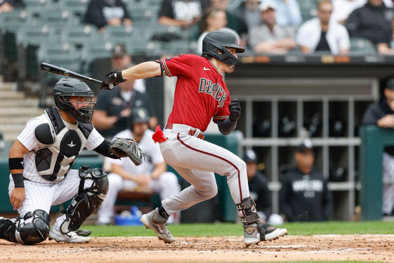 Sep 27, 2023; Chicago, Illinois, USA; Arizona Diamondbacks left fielder Corbin Carroll (7) hits a two-run double against the Chicago White Sox during the third inning at Guaranteed Rate Field. Mandatory Credit: Kamil Krzaczynski-USA TODAY Sports