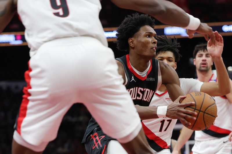 HOUSTON, TEXAS - NOVEMBER 22: Amen Thompson #1 of the Houston Rockets dribbles the ball to the basket against the Portland Trail Blazers during the second half in the NBA Emirates Cup at Toyota Center on November 22, 2024 in Houston, Texas.  NOTE TO USER: User expressly acknowledges and agrees that, by downloading and or using this photograph, User is consenting to the terms and conditions of the Getty Images License Agreement. (Photo by Alex Slitz/Getty Images)