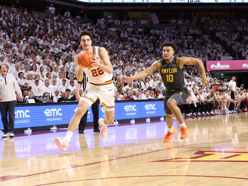 Feb 7, 2026; Ames, Iowa, USA; Iowa State Cyclones forward Milan Momcilovic (22) beats 10 down the court during the first half at James H. Hilton Coliseum. Mandatory Credit: Reese Strickland-Imagn Images