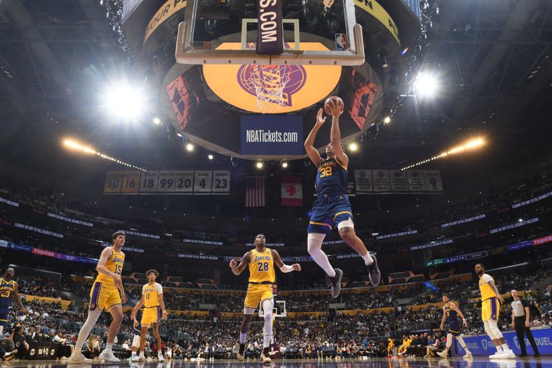 LOS ANGELES, CA - APRIL 9: Trayce Jackson-Davis #32 of the Golden State Warriors  drives to the basket during the game against the Los Angeles Lakers on April 9, 2024 at Crypto.Com Arena in Los Angeles, California. NOTE TO USER: User expressly acknowledges and agrees that, by downloading and/or using this Photograph, user is consenting to the terms and conditions of the Getty Images License Agreement. Mandatory Copyright Notice: Copyright 2024 NBAE (Photo by Andrew D. Bernstein/NBAE via Getty Images)