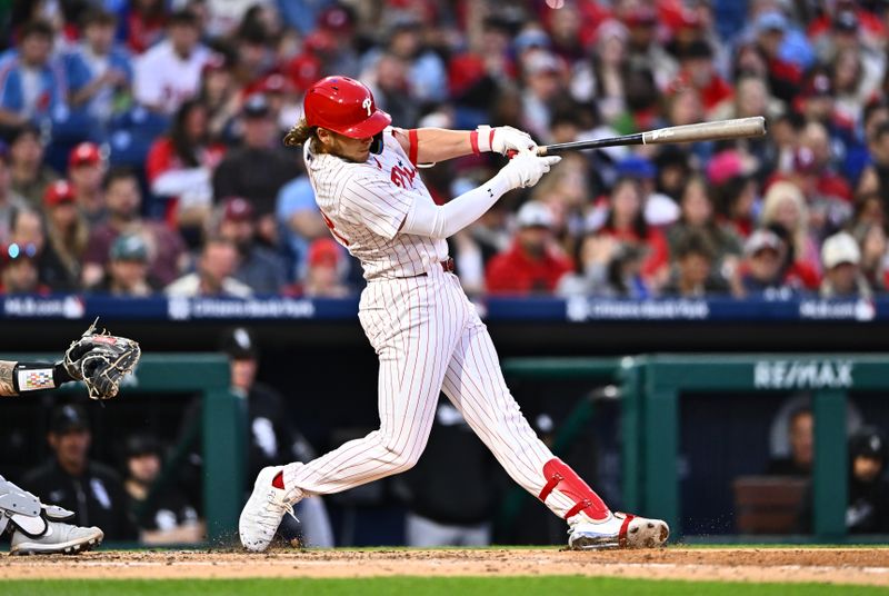 Apr 20, 2024; Philadelphia, Pennsylvania, USA; Philadelphia Phillies infielder Alec Bohm (28) hits a single against the Chicago White Sox in the fifth inning at Citizens Bank Park. Mandatory Credit: Kyle Ross-USA TODAY Sports
