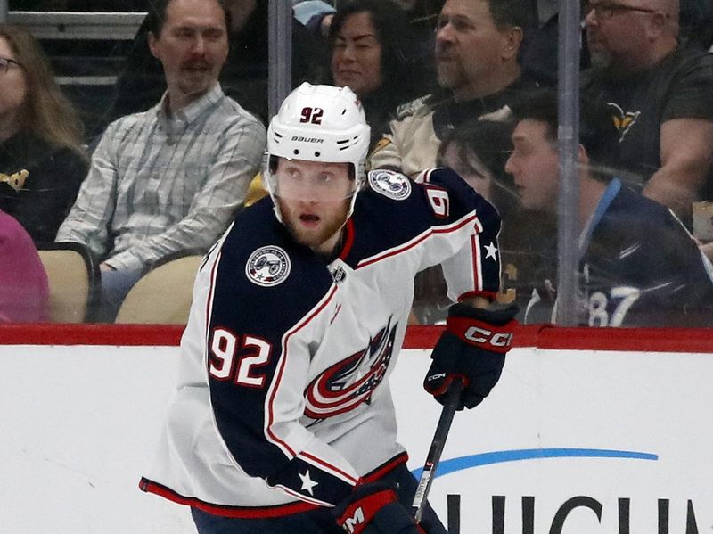 Mar 5, 2024; Pittsburgh, Pennsylvania, USA; Columbus Blue Jackets left wing Alexander Nylander (92) skates with the puck against the Pittsburgh Penguins during the first period at PPG Paints Arena. Mandatory Credit: Charles LeClaire-USA TODAY Sports