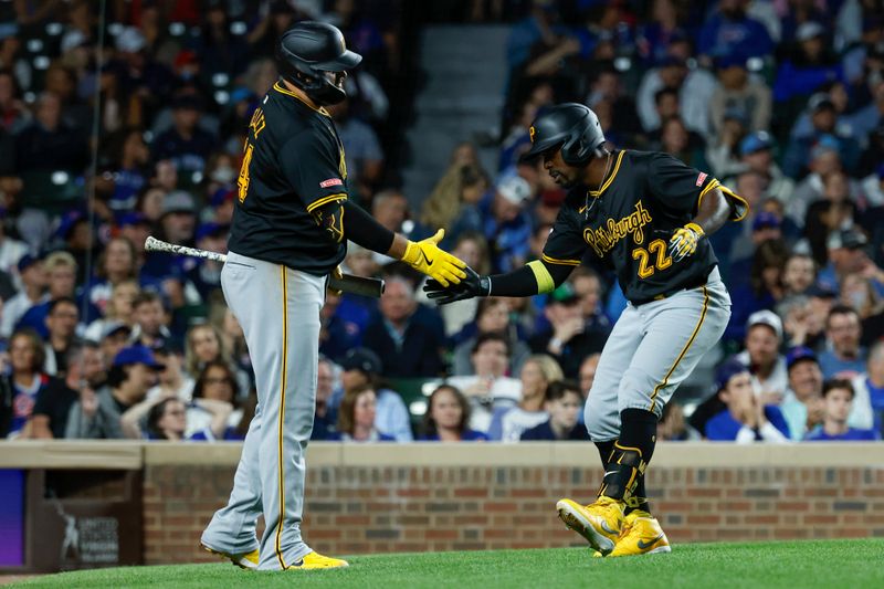 Sep 2, 2024; Chicago, Illinois, USA; Pittsburgh Pirates outfielder Andrew McCutchen (22) celebrates with first baseman Rowdy Tellez (44) after hitting a solo home run against the Chicago Cubs during the eight inning at Wrigley Field. Mandatory Credit: Kamil Krzaczynski-USA TODAY Sports