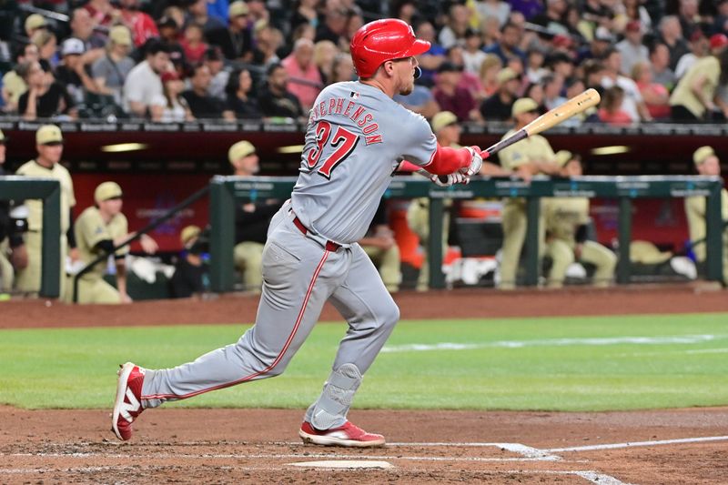 May 14, 2024; Phoenix, Arizona, USA;  Cincinnati Reds catcher Tyler Stephenson (37) doubles in the fourth inning against the Arizona Diamondbacks at Chase Field. Mandatory Credit: Matt Kartozian-USA TODAY Sports