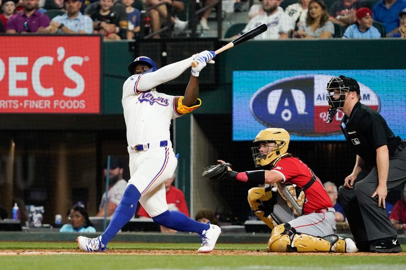 May 18, 2024; Arlington, Texas, USA; Texas Rangers right fielder Adolis Garcia (53) hits a solo home run during the sixth inning against the Los Angeles Angels at Globe Life Field. Mandatory Credit: Raymond Carlin III-USA TODAY Sports