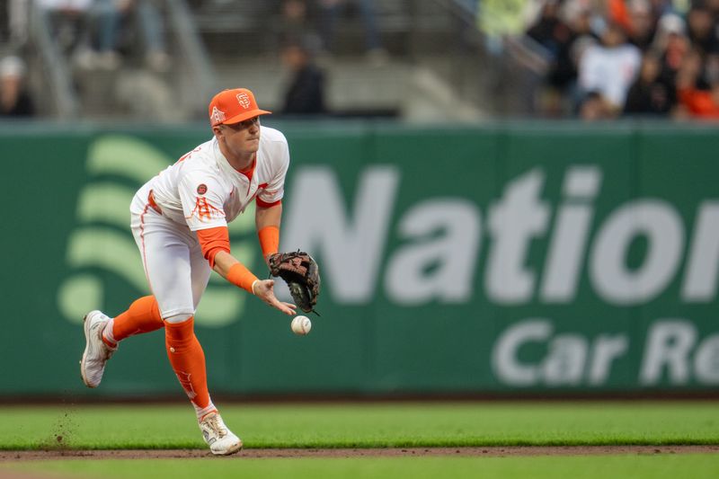 Jul 9, 2024; San Francisco, California, USA;  San Francisco Giants short stop Tyler Fitzgerald (49) starts a double play against the Toronto Blue Jays during the third inning at Oracle Park. Mandatory Credit: Neville E. Guard-USA TODAY Sports