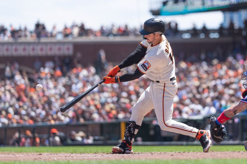 Aug 13, 2023; San Francisco, California, USA; San Francisco Giants catcher Patrick Bailey (14) hits a single during the fourth inning against the Texas Rangers at Oracle Park. Mandatory Credit: Stan Szeto-USA TODAY Sports