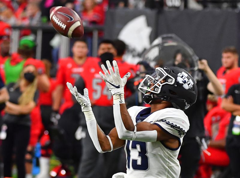 Oct 16, 2021; Paradise, Nevada, USA; Utah State Aggies wide receiver Deven Thompkins (13) reaches for the ball on a 37-yard touchdown reception against the UNLV Rebels at Allegiant Stadium. Mandatory Credit: Stephen R. Sylvanie-USA TODAY Sports