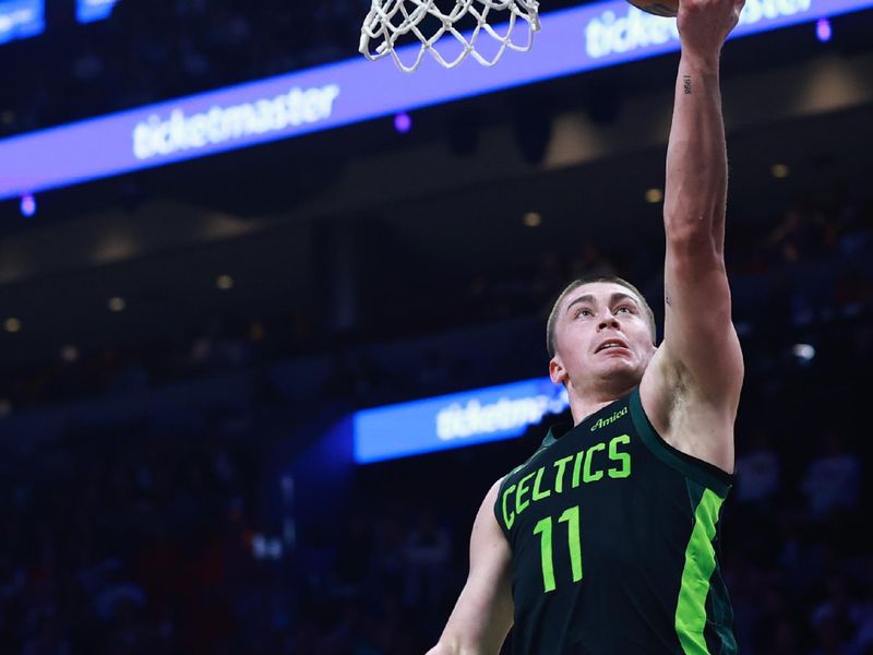 MIAMI, FLORIDA - FEBRUARY 10: Payton Pritchard #11 of the Boston Celtics drives to the net against the Miami Heat during the first half at Kaseya Center on February 10, 2025 in Miami, Florida. NOTE TO USER: User expressly acknowledges and agrees that, by downloading and or using this Photograph, user is consenting to the terms and conditions of the Getty Images License Agreement. (Photo by Carmen Mandato/Getty Images)