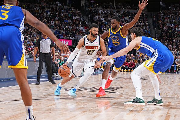 DENVER, CO - DECEMBER 25: Jamal Murray #27 of the Denver Nuggets dribbles the ball during the game against the Golden State Warriors on December 25, 2023 at the Ball Arena in Denver, Colorado. NOTE TO USER: User expressly acknowledges and agrees that, by downloading and/or using this Photograph, user is consenting to the terms and conditions of the Getty Images License Agreement. Mandatory Copyright Notice: Copyright 2023 NBAE (Photo by Garrett Ellwood/NBAE via Getty Images)