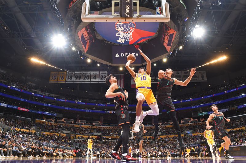 LOS ANGELES, CA - FEBRUARY 29: Max Christie #10 of the Los Angeles Lakers drives to the basket during the game against the Washington Wizards on February 29, 2024 at Crypto.Com Arena in Los Angeles, California. NOTE TO USER: User expressly acknowledges and agrees that, by downloading and/or using this Photograph, user is consenting to the terms and conditions of the Getty Images License Agreement. Mandatory Copyright Notice: Copyright 2024 NBAE (Photo by Andrew D. Bernstein/NBAE via Getty Images)