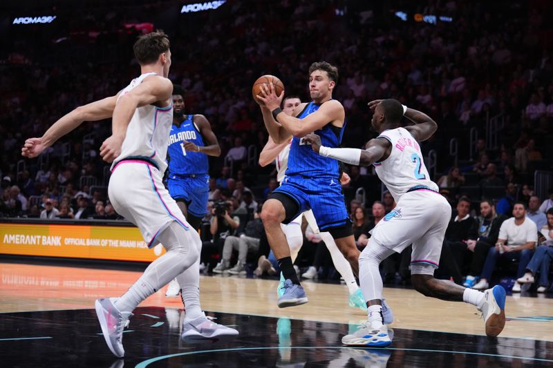 MIAMI, FLORIDA - JANUARY 27: Franz Wagner #22 of the Orlando Magic dribbles the ball against Terry Rozier #2 of the Miami Heat during the first quarter at Kaseya Center on January 27, 2025 in Miami, Florida. NOTE TO USER: User expressly acknowledges and agrees that, by downloading and or using this photograph, User is consenting to the terms and conditions of the Getty Images License Agreement. (Photo by Rich Storry/Getty Images)