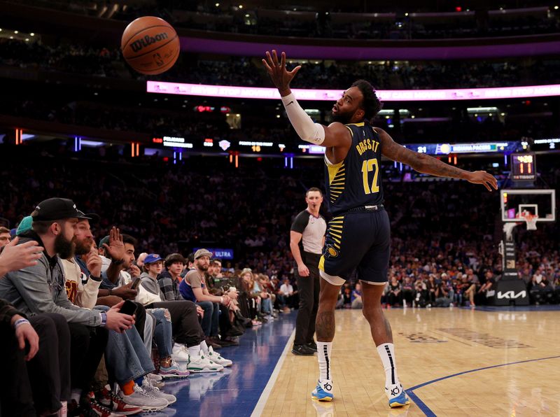 NEW YORK, NEW YORK - APRIL 09:  Oshae Brissett #12 of the Indiana Pacers is unable to catch a high pass in the first half against the New York Knicks at Madison Square Garden on April 09, 2023 in New York City. NOTE TO USER: User expressly acknowledges and agrees that, by downloading and or using this photograph, User is consenting to the terms and conditions of the Getty Images License Agreement. (Photo by Elsa/Getty Images)