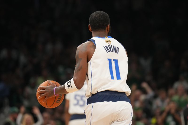 BOSTON, MA - JUNE 9: Kyrie Irving #11 of the Dallas Mavericks dribbles the ball during the game against the Boston Celtics during Game 2 of the 2024 NBA Finals on June 9, 2024 at the TD Garden in Boston, Massachusetts. NOTE TO USER: User expressly acknowledges and agrees that, by downloading and or using this photograph, User is consenting to the terms and conditions of the Getty Images License Agreement. Mandatory Copyright Notice: Copyright 2024 NBAE  (Photo by Jesse D. Garrabrant/NBAE via Getty Images)