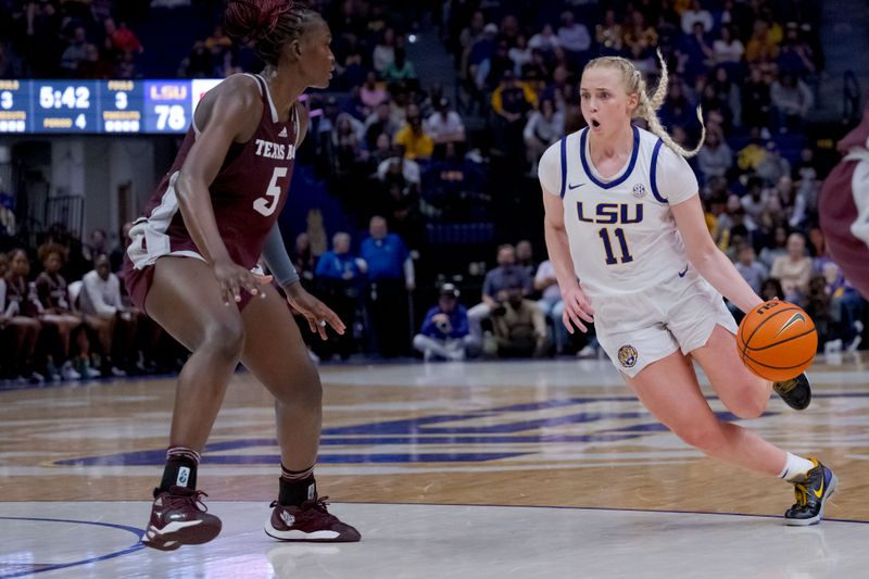 Jan 11, 2024; Baton Rouge, Louisiana, USA; LSU Lady Tigers guard Hailey Van Lith (11) dribbles around Texas A&M Aggies guard Aicha Coulibaly (5) during the second half at Pete Maravich Assembly Center. Mandatory Credit: Matthew Hinton-USA TODAY Sports