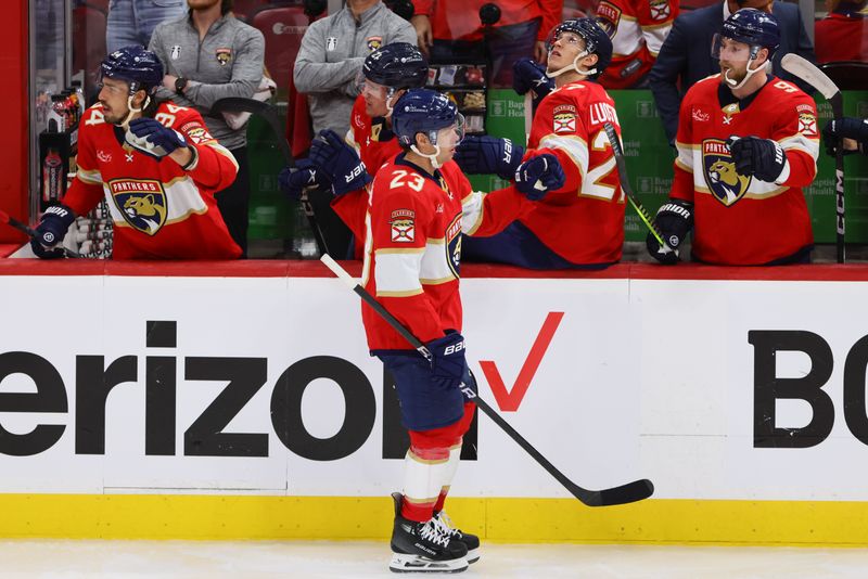 Apr 21, 2024; Sunrise, Florida, USA; Florida Panthers center Carter Verhaeghe (23) celebrates after scoring against the Tampa Bay Lightning during the third period in game one of the first round of the 2024 Stanley Cup Playoffs at Amerant Bank Arena. Mandatory Credit: Sam Navarro-USA TODAY Sports