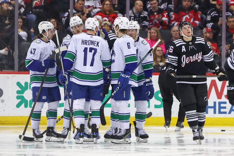 Jan 6, 2024; Newark, New Jersey, USA; Vancouver Canucks center Elias Pettersson (40) celebrates his goal against the New Jersey Devils during the second period at Prudential Center. Mandatory Credit: Ed Mulholland-USA TODAY Sports