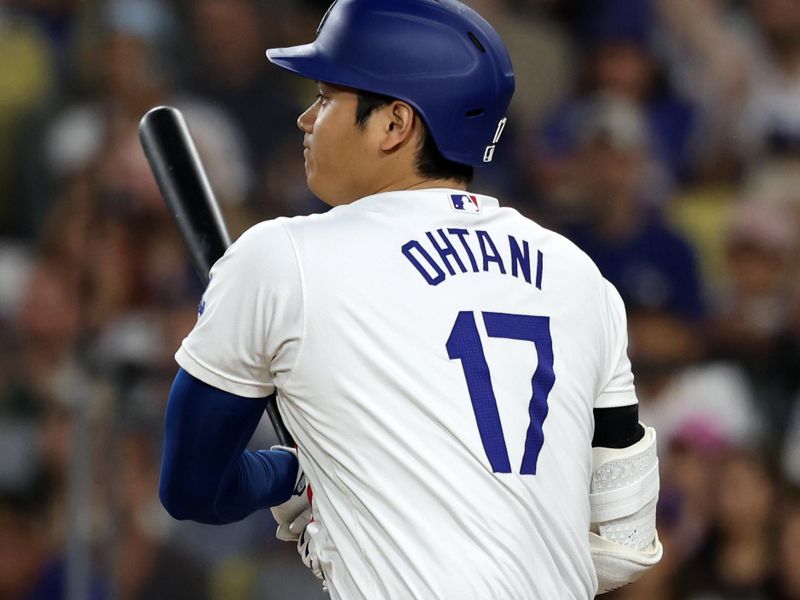 Sep 10, 2024; Los Angeles, California, USA;  Los Angeles Dodgers designated hitter Shohei Ohtani (17) grounds into a double play during the third inning against the Chicago Cubs at Dodger Stadium. Mandatory Credit: Kiyoshi Mio-Imagn Images