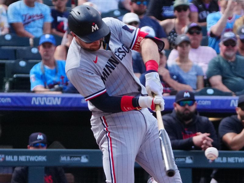 Oct 1, 2023; Denver, Colorado, USA; Minnesota Twins catcher Ryan Jeffers (27) singles in the second inning against the Colorado Rockies at Coors Field. Mandatory Credit: Ron Chenoy-USA TODAY Sports