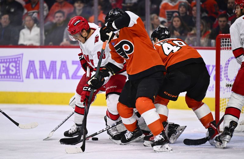 Nov 28, 2023; Philadelphia, Pennsylvania, USA; Carolina Hurricanes left wing Teuvo Teravainen (86) and Philadelphia Flyers right wing Cam Atkinson (89) battle for a loose puck in the second period at Wells Fargo Center. Mandatory Credit: Kyle Ross-USA TODAY Sports