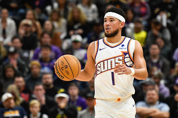 SALT LAKE CITY, UTAH - NOVEMBER 19: Devin Booker #1 of the Phoenix Suns in action during the second half of a game against the Utah Jazz at Delta Center on November 19, 2023 in Salt Lake City, Utah. NOTE TO USER: User expressly acknowledges and agrees that, by downloading and or using this photograph, User is consenting to the terms and conditions of the Getty Images License Agreement. (Photo by Alex Goodlett/Getty Images)