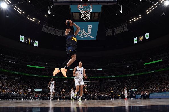 DENVER, CO - DECEMBER 18: Jamal Murray #27 of the Denver Nuggets drives to the basket during the game against the Dallas Mavericks on December 18, 2023 at the Ball Arena in Denver, Colorado. NOTE TO USER: User expressly acknowledges and agrees that, by downloading and/or using this Photograph, user is consenting to the terms and conditions of the Getty Images License Agreement. Mandatory Copyright Notice: Copyright 2023 NBAE (Photo by Garrett Ellwood/NBAE via Getty Images)