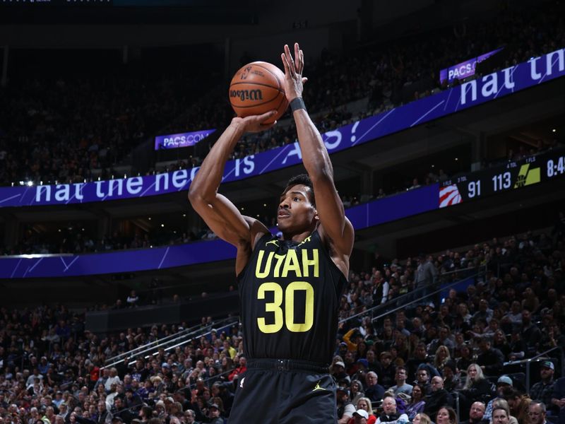 SALT LAKE CITY, UT - JANUARY 12: Ochai Agbaji #30 of the Utah Jazz shoots a three point basket during the game against the Toronto Raptors on January 12, 2024 at Delta Center in Salt Lake City, Utah. NOTE TO USER: User expressly acknowledges and agrees that, by downloading and or using this Photograph, User is consenting to the terms and conditions of the Getty Images License Agreement. Mandatory Copyright Notice: Copyright 2024 NBAE (Photo by Melissa Majchrzak/NBAE via Getty Images)