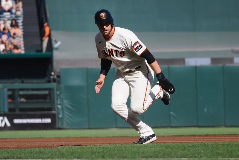 Aug 27, 2023; San Francisco, California, USA; San Francisco Giants center fielder Austin Slater (13) runs for third base against the Atlanta Braves during the first inning at Oracle Park. Mandatory Credit: Kelley L Cox-USA TODAY Sports