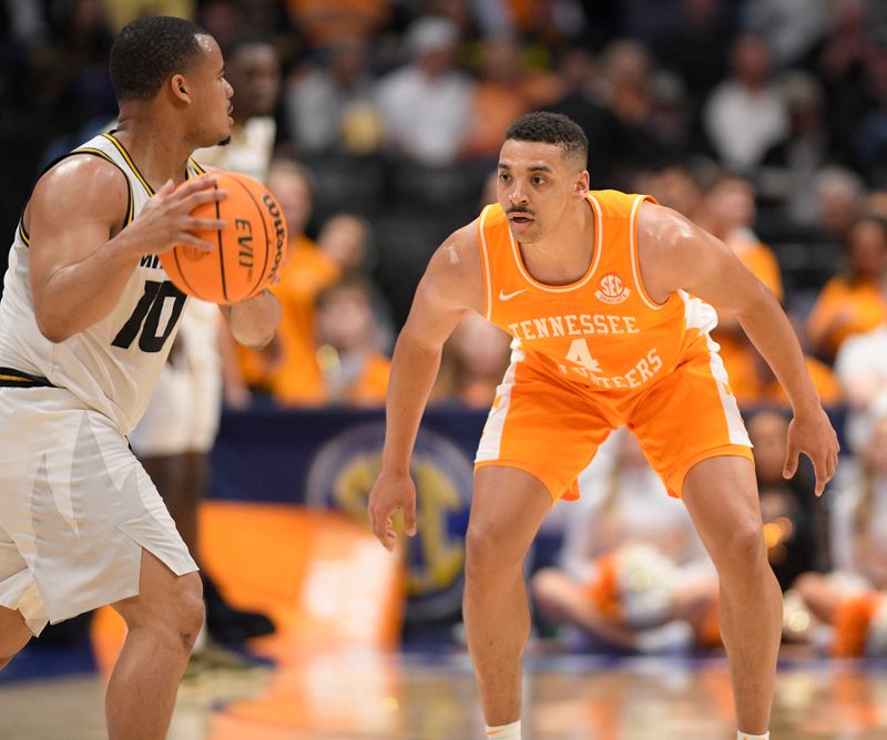 Mar 10, 2023; Nashville, TN, USA;  Tennessee Volunteers guard Tyreke Key (4) guards Missouri Tigers guard Nick Honor (10) during the first half at Bridgestone Arena. Mandatory Credit: Steve Roberts-USA TODAY Sports