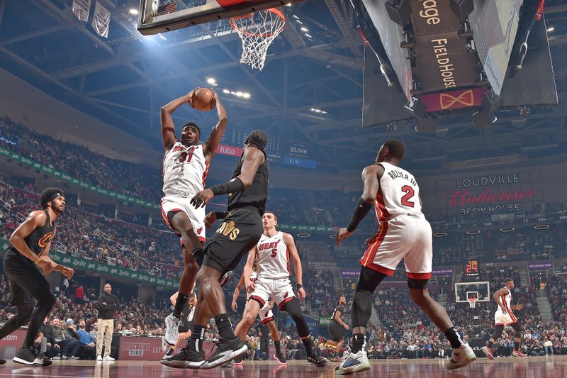 CLEVELAND, OH - MARCH 20: Thomas Bryant #31 of the Miami Heat grabs a rebound during the game against the Cleveland Cavaliers on March 20, 2024 at Rocket Mortgage FieldHouse in Cleveland, Ohio. NOTE TO USER: User expressly acknowledges and agrees that, by downloading and/or using this Photograph, user is consenting to the terms and conditions of the Getty Images License Agreement. Mandatory Copyright Notice: Copyright 2024 NBAE (Photo by David Liam Kyle/NBAE via Getty Images)