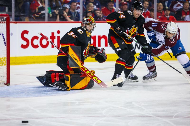 Mar 12, 2024; Calgary, Alberta, CAN; Calgary Flames goaltender Dustin Wolf (32) guards his net against the Colorado Avalanche during the third period at Scotiabank Saddledome. Mandatory Credit: Sergei Belski-USA TODAY Sports