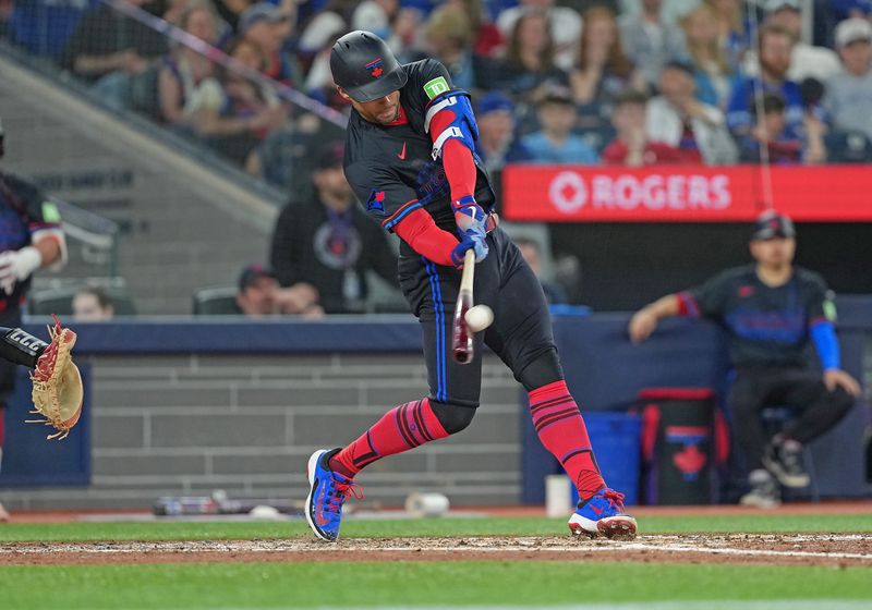 May 2, 2025; Toronto, Ontario, CAN; Toronto Blue Jays designated hitter George Springer (4) hits a home run against the Cleveland Guardians during the fifth inning at Rogers Centre. Mandatory Credit: Nick Turchiaro-Imagn Images
