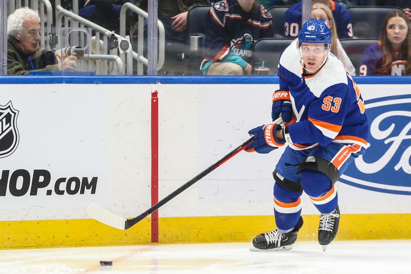 Feb 10, 2024; Elmont, New York, USA;  New York Islanders center Casey Cizikas (53) controls the puck in the third period against the Calgary Flames at UBS Arena. Mandatory Credit: Wendell Cruz-USA TODAY Sports